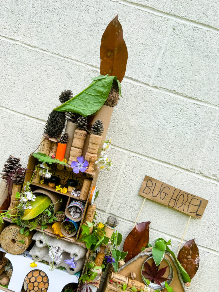 Top view of Bug Hotel for kids made with recycled materials and items from nature.