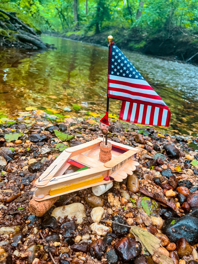 DIY Boats : Boat made from jumbo popsicle sticks with river in the background