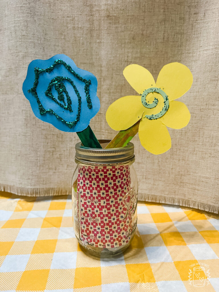 Spring flower craft made from glitter and cardstock paper.