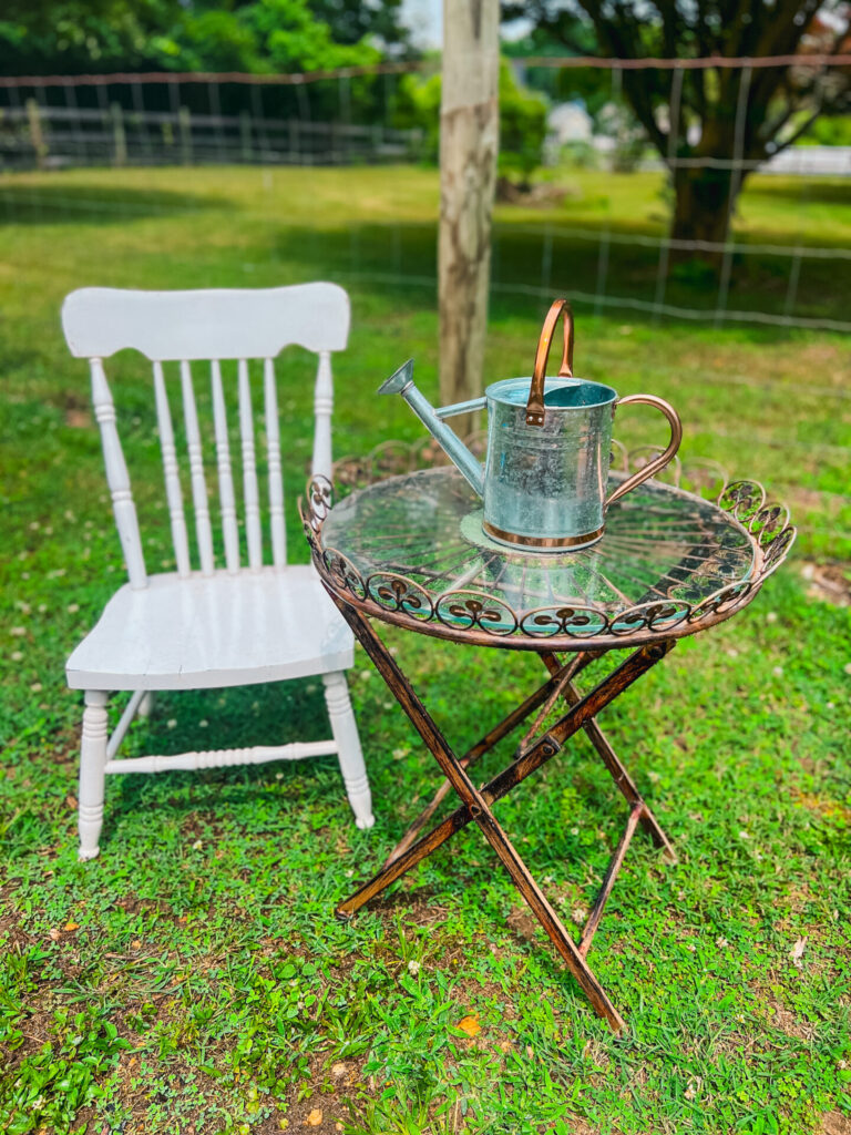 Garden chair and water pail found at a thrift store.