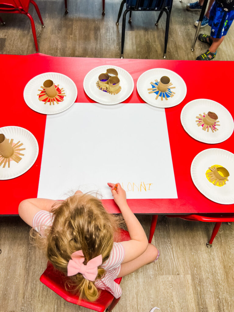 Summer Crafts - Fireworks Craft Set Up. One color paint and toilet paper stamp per plate.