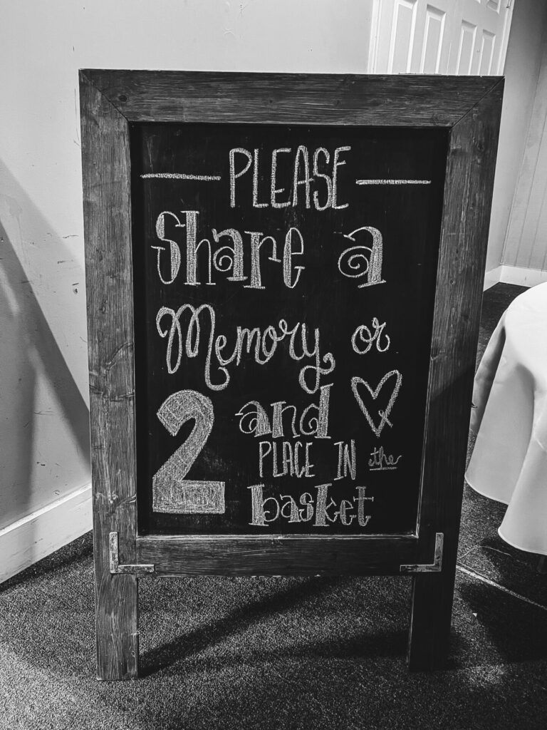 Memory Cards instructions written on a chalkboard: Please share a memory or 2 and place in the basket.