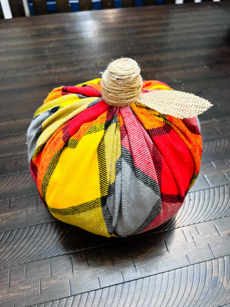 Fabric Pumpkin with red, yellow, and blue plaid fabric.