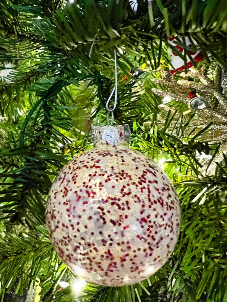Christmas Ornaments made from white crayon shavings and red glitter.
